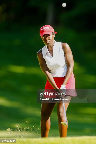 Lakareber Abe of Alabama chips onto the green during the Division I Women's Golf Team Match Play Championship held at the Karsten Creek Golf Club on...