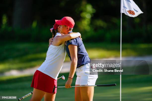 Kristen Gillman of Alabama and Gigi Stoll of Arizona hug after the completion of their match during the Division I Women's Golf Team Match Play...
