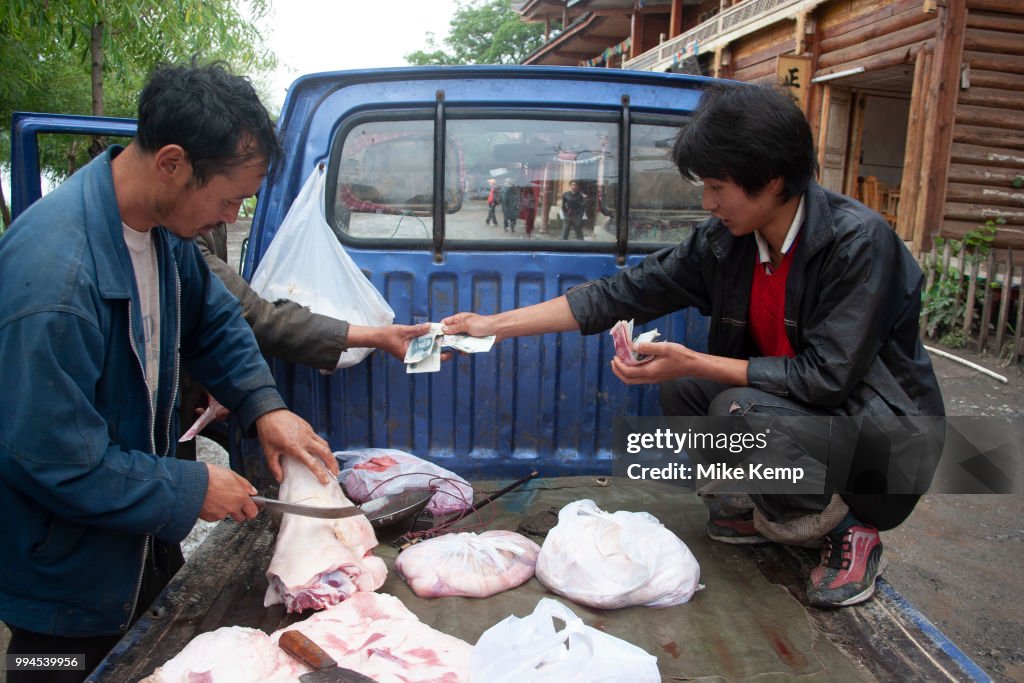 Meat Seller At Lugu Lake Yunnan China