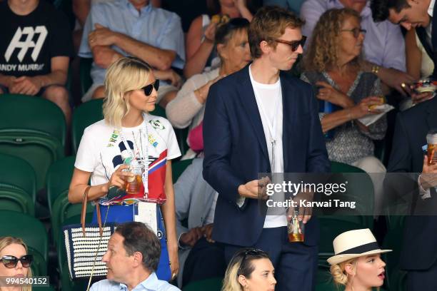 Poppy Delevingne and her husband James Cook attend day seven of the Wimbledon Tennis Championships at the All England Lawn Tennis and Croquet Club on...