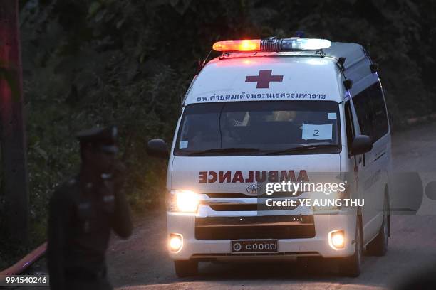 An ambulance exits from the Tham Luang cave area as rescue operations continue for those still trapped inside the cave in Khun Nam Nang Non Forest...