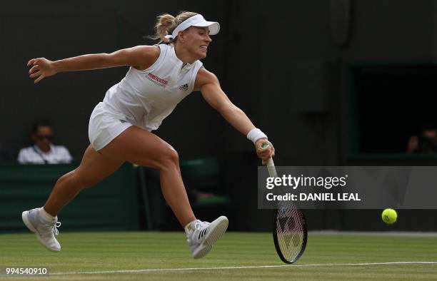 Germany's Angelique Kerber returns against Switzerland's Belinda Bencic during their women's singles fourth round match on the seventh day of the...