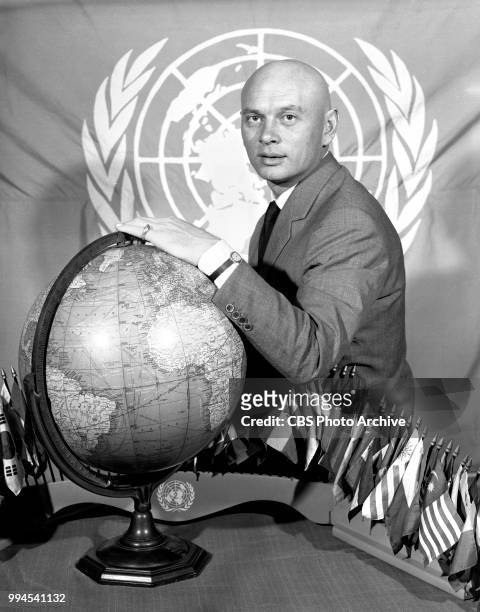 Portrait of actor Yul Brynner with a world globe. CBS Reports, episode titled: Rescue, with Yul Brynner. The actor scheduled to visit and report on...