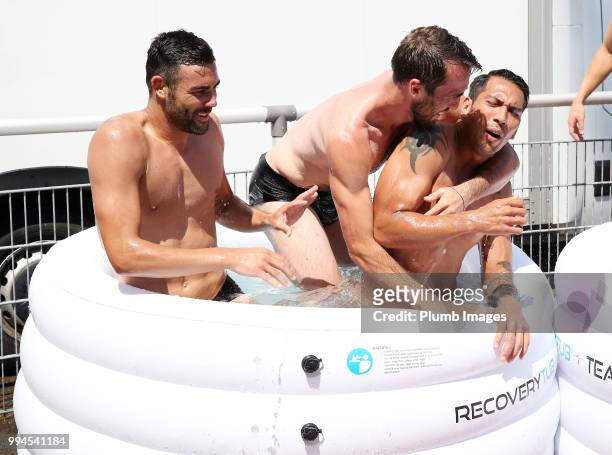 Christian Fuchs jokes with Leo Ulloa and Vicente Iborra during the Leicester City pre-season training camp on July 09, 2018 in Evian, France.