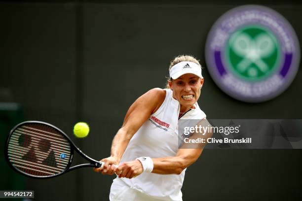 Angelique Kerber of Germany plays a backhand against Belinda Bencic of Switzerland during their Ladies' Singles fourth round match on day seven of...