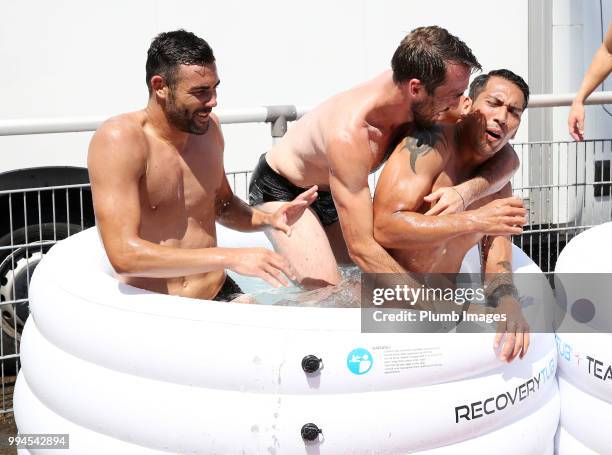 Christian Fuchs jokes with Leo Ulloa and Vicente Iborra during the Leicester City pre-season training camp on July 09, 2018 in Evian, France.