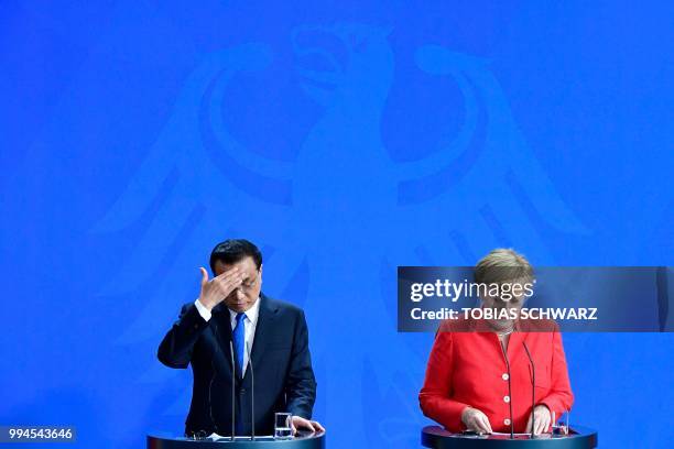 German Chancellor Angela Merkel and Chinese Premier Li Keqiang attend a press conference at the Chancellery in Berlin on July 9, 2018. German...