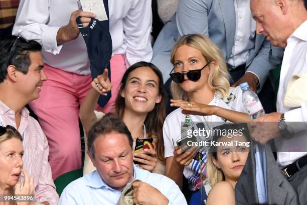 Alexa Chung and Poppy Delevingne attend day seven of the Wimbledon Tennis Championships at the All England Lawn Tennis and Croquet Club on July 9,...