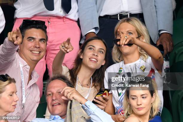 Alexa Chung and Poppy Delevingne attend day seven of the Wimbledon Tennis Championships at the All England Lawn Tennis and Croquet Club on July 9,...