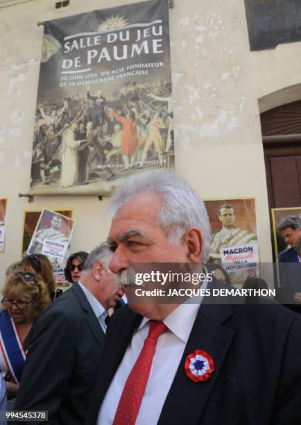 French MP Andre Chassaigne and communist parliamentarians gather in front of the Jeu de Paume hall in Paris on July 9 shortly before the start of the...