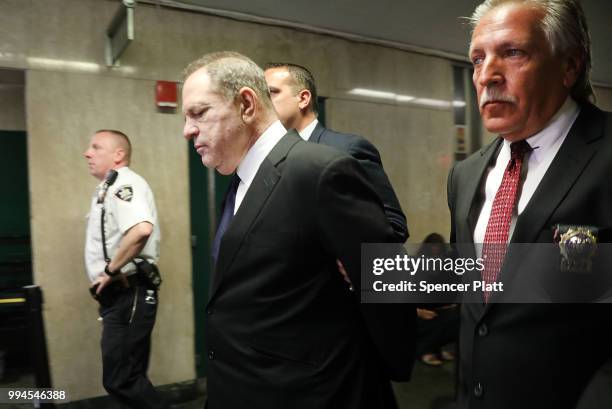 Harvey Weinstein is escorted in handcuffs into State Supreme Court on Monday for arraignment on charges alleging he committed a sex crime against a...