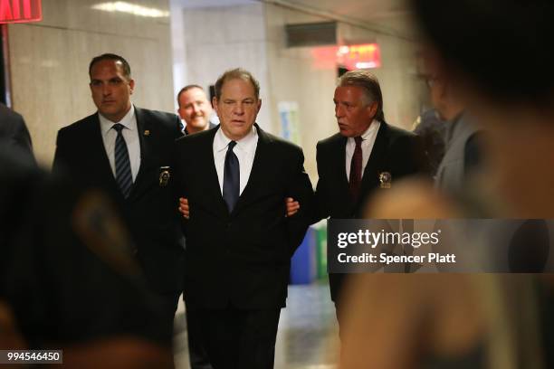 Harvey Weinstein is escorted in handcuffs into State Supreme Court after on Monday for arraignment on charges alleging he committed a sex crime...
