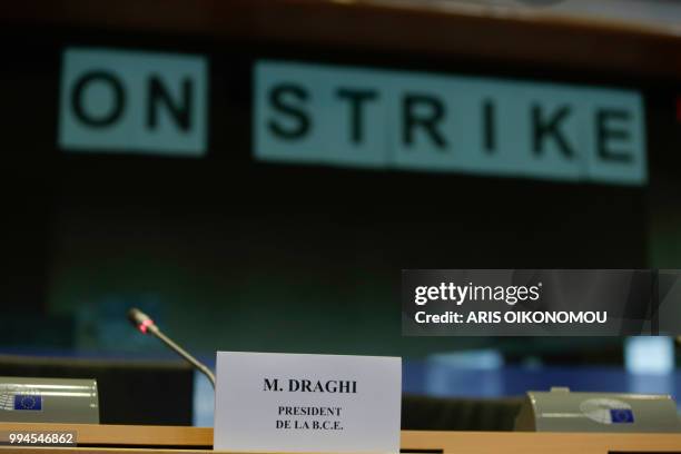 Interpreters at the European Parliament stick "On strike" banners on the windows of the their booths after 35 days of strike before the arrival of...