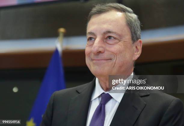 European Central Bank President Mario Draghi arrives to deliver a speech during a meeting of the Committee on economic and monetary affairs at the...