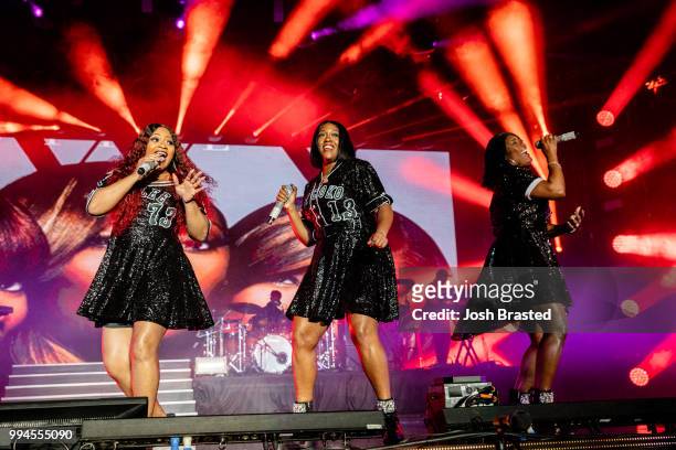 Leanne 'Lelee' Lyons, Cheryl 'Coko' Clemons, and Tamara 'Taj' Johnson-George of SWV perform onstage during the 2018 Essence Festival at the...