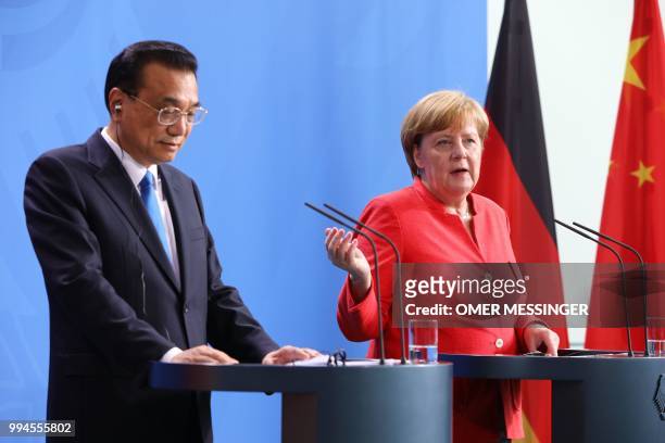 German Chancellor Angela Merkel and Chinese Premier Li Keqiang attend a press conference at the Chancellery in Berlin on July 9, 2018. - German...