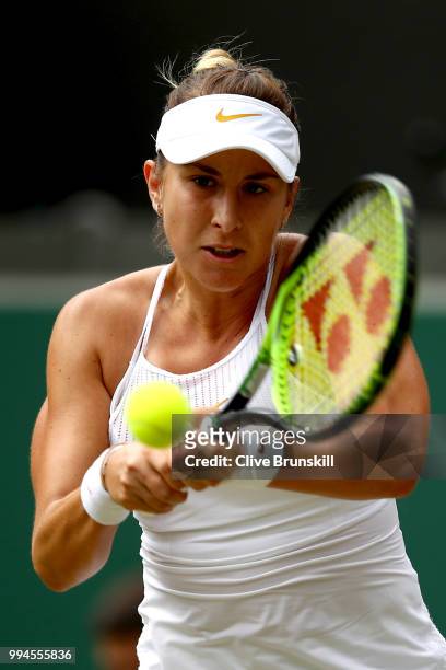 Belinda Bencic of Switzerland plays a backhand against Angelique Kerber of Germany during their Ladies' Singles fourth round match on day seven of...