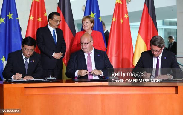 China's Minister of Industry and Information Technology Miao Wei, German Economy Minister Peter Altmaier and German Transport Minister Andreas...