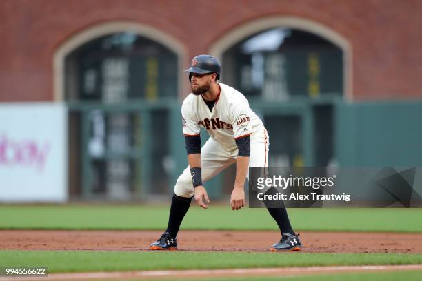 Brandon Belt of the San Francisco Giants takes a lead off first base during a game against the Colorado Rockies at AT&T Park on Wednesday, June 27,...