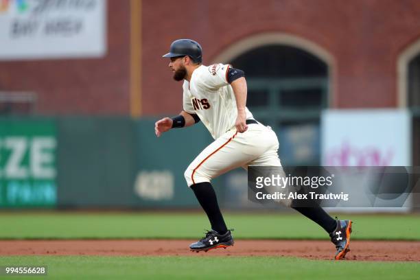 Brandon Belt of the San Francisco Giants runs to second base during a game against the Colorado Rockies at AT&T Park on Wednesday, June 27, 2018 in...