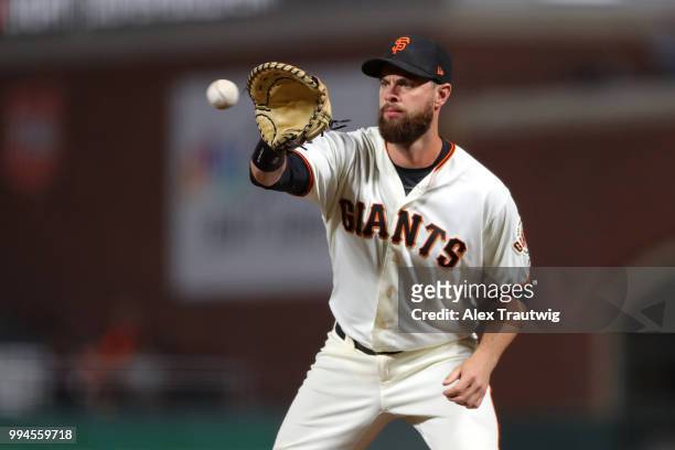 Brandon Belt of the San Francisco Giants makes a catch at first base during a game against the Colorado Rockies at AT&T Park on Wednesday, June 27,...