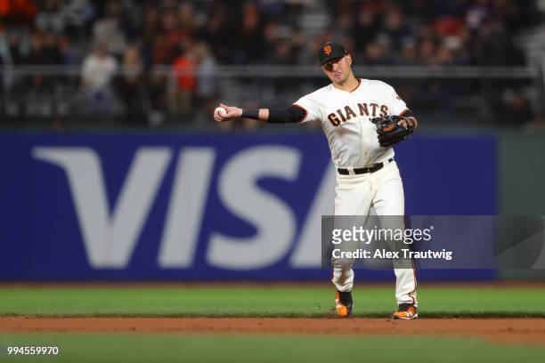 Joe Panik of the San Francisco Giants throws to first base during a game against the Colorado Rockies at AT&T Park on Wednesday, June 27, 2018 in San...