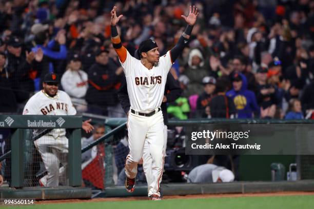 Gorkys Hernandez celebrates after Brandon Crawford of the San Francisco Giants hit a walk-off home run in the ninth inning to defeat the Colorado...