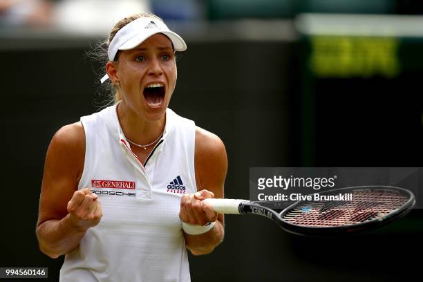 Angelique Kerber of Germany celebrates winning match point in her Ladies' Singles fourth round match against Belinda Bencic of Switzerland on day...