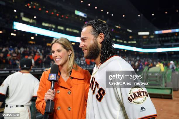 Brandon Crawford of the San Francisco Giants is interviewed after hitting a walk-off home run in the ninth inning to defeat the Colorado Rockies 1-0...