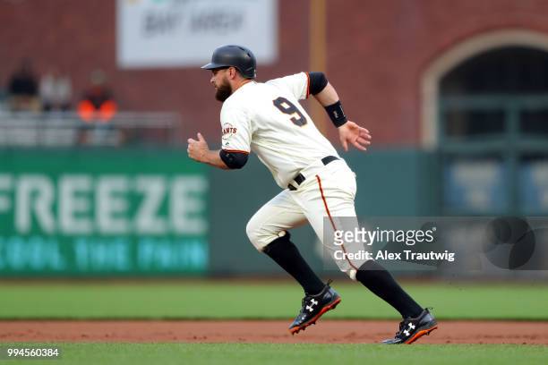 Brandon Belt of the San Francisco Giants runs to second base during a game against the Colorado Rockies at AT&T Park on Wednesday, June 27, 2018 in...