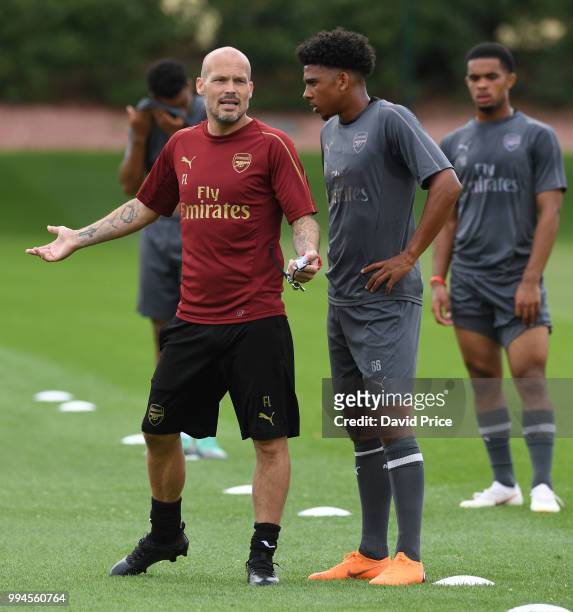 Freddie Ljungberg the Arsenal U23 Head Coach chats to Xavier Amaechi at London Colney on July 9, 2018 in St Albans, England.