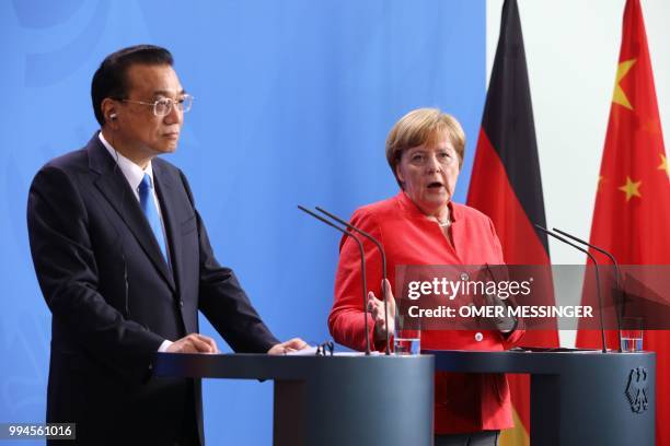 German Chancellor Angela Merkel and Chinese Premier Li Keqiang attend a press conference at the Chancellery in Berlin on July 9, 2018. - German...