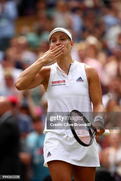 Angelique Kerber of Germany thanks the crowd after winning her Ladies' Singles fourth round match against Belinda Bencic of Switzerland on day seven...