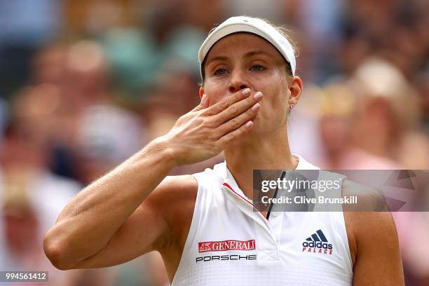 Angelique Kerber of Germany thanks the crowd after winning her Ladies' Singles fourth round match against Belinda Bencic of Switzerland on day seven...