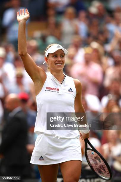 Angelique Kerber of Germany thanks the crowd after winning her Ladies' Singles fourth round match against Belinda Bencic of Switzerland on day seven...