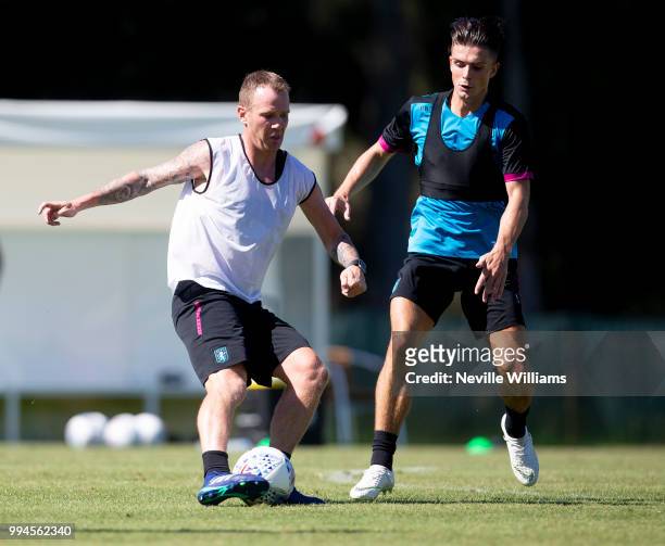 Glenn Whelan of Aston Villa in action with team mate Jack Grealish during an Aston Villa training session at the club's training camp on July 09,...