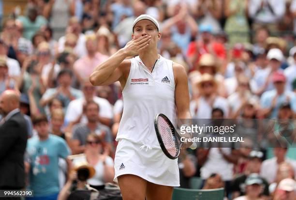 Germany's Angelique Kerber reacts after winning against Switzerland's Belinda Bencic during their women's singles fourth round match on the seventh...