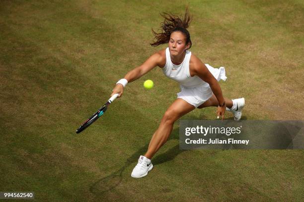 Daria Kasatkina of Russia plays a forehand against Alison Van Uytvanck of Belgium during their Ladies' Singles fourth round match on day seven of the...