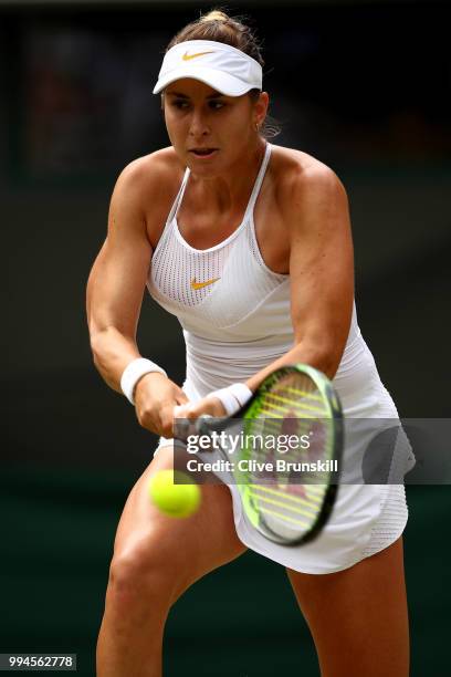 Belinda Bencic of Switzerland plays a backhand against Angelique Kerber of Germany during their Ladies' Singles fourth round match on day seven of...