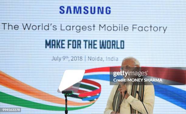 Indian Prime Minister Narendra Modi speaks during the inauguration of the world's largest smartphone factory -- an assembling plant that is an...