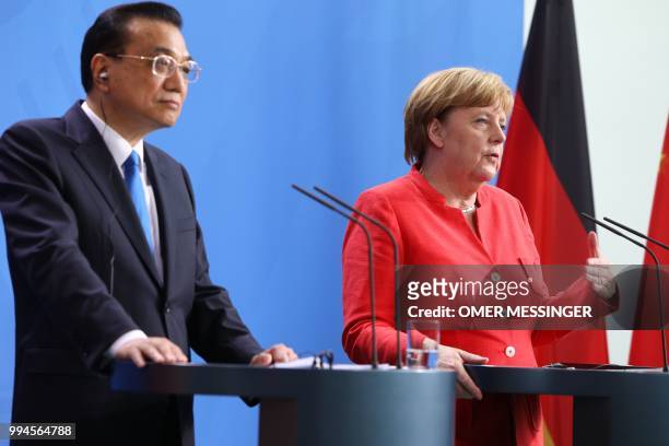 German Chancellor Angela Merkel and Chinese Premier Li Keqiang attend a press conference at the Chancellery in Berlin on July 9, 2018. - German...