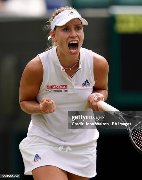 Angelique Kerber celebrates her win against Belinda Bencic on day seven of the Wimbledon Championships at the All England Lawn Tennis and Croquet...