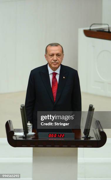 Turkey's President Recep Tayyip Erdogan receives his oath as he is sworns as Turkey's first Executive President at the Turkish parliament on July 9,...