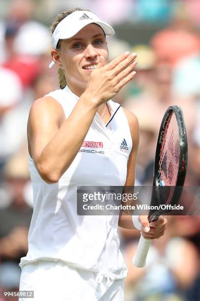 Women's Singles - Angelique Kerber v Belinda Bencic - Angelique Kerber blows kisses to the crowd after winning the match at All England Lawn Tennis...