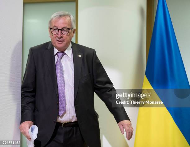 President of the European Commission Jean-Claude Juncker arrives to talk to the media at the end of the European Union/Ukraine Summit at the EU...