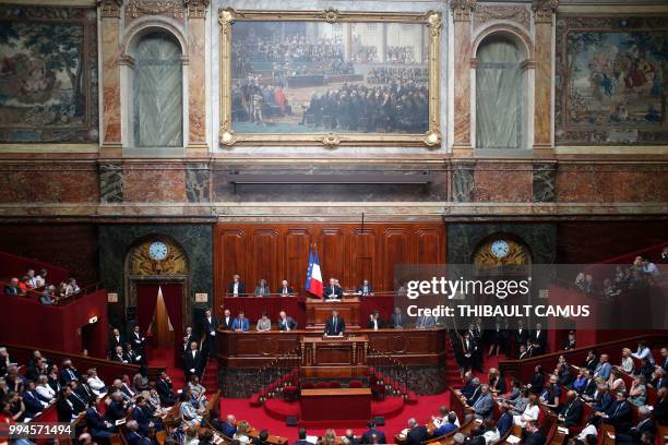 French President Emmanuel Macron addresses of a special congress gathering both houses of Parliament at the congress hemicycle room in the Palace of...