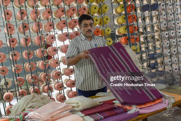 Prisoner shows the products made in the Weaving Unit inside Jail Number 2 in Tihar Jail on June 21, 2018 in New Delhi, India. The thousands of...