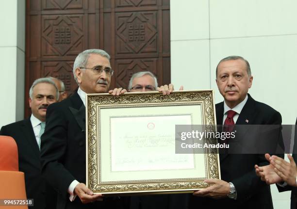 Speaker of Turkish Grand National Assembly Durmus Yilmaz presents certificate of election to Turkish President Recep Tayyip Erdogan after Erdogan...