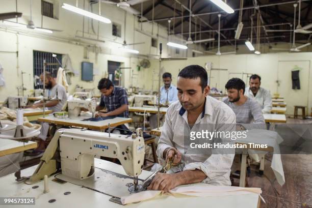 Prisoners stitch clothes in the Tailoring Unit inside Jail Number 2 in Tihar Jail on June 21, 2018 in New Delhi, India. The thousands of inmates at...