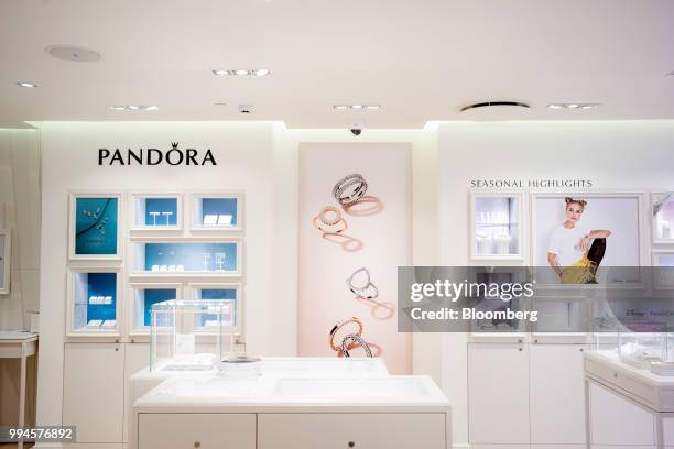 Jewelry sits in display cases at a Pandora AS shop in Copenhagen, Denmark, on Monday, July 9, 2018. Pandora designs, manufactures, markets, and...